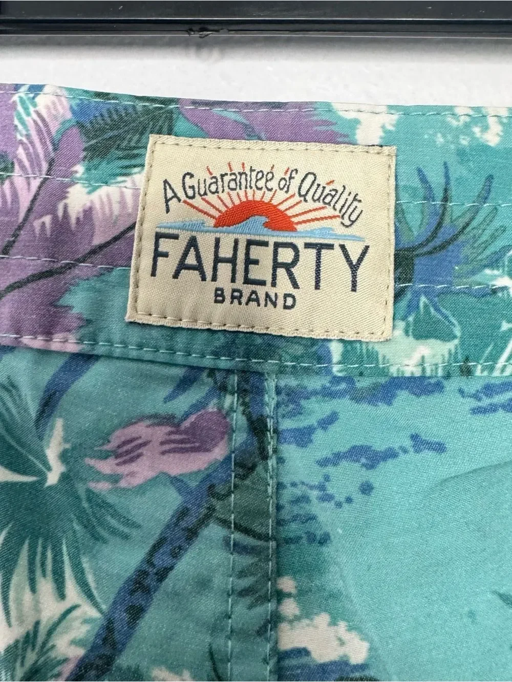Faherty board shorts featuring a tropical print size 32